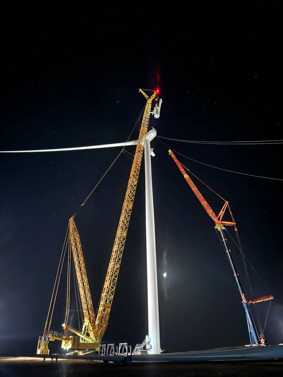 SOMALEV crawler crane installing a wind turbine at night