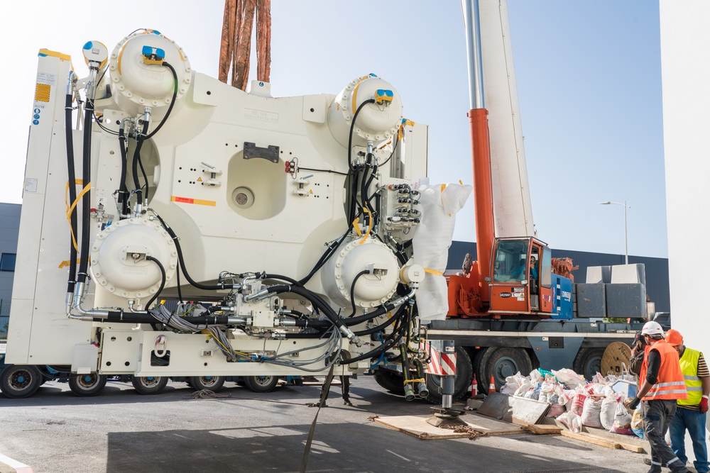 Industrial equipment being lifted during a relocation
